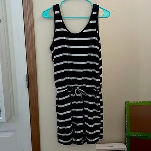 Black and white striped romper with tie at the waist.